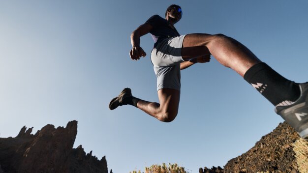 Man jumping in a mountainous landscape